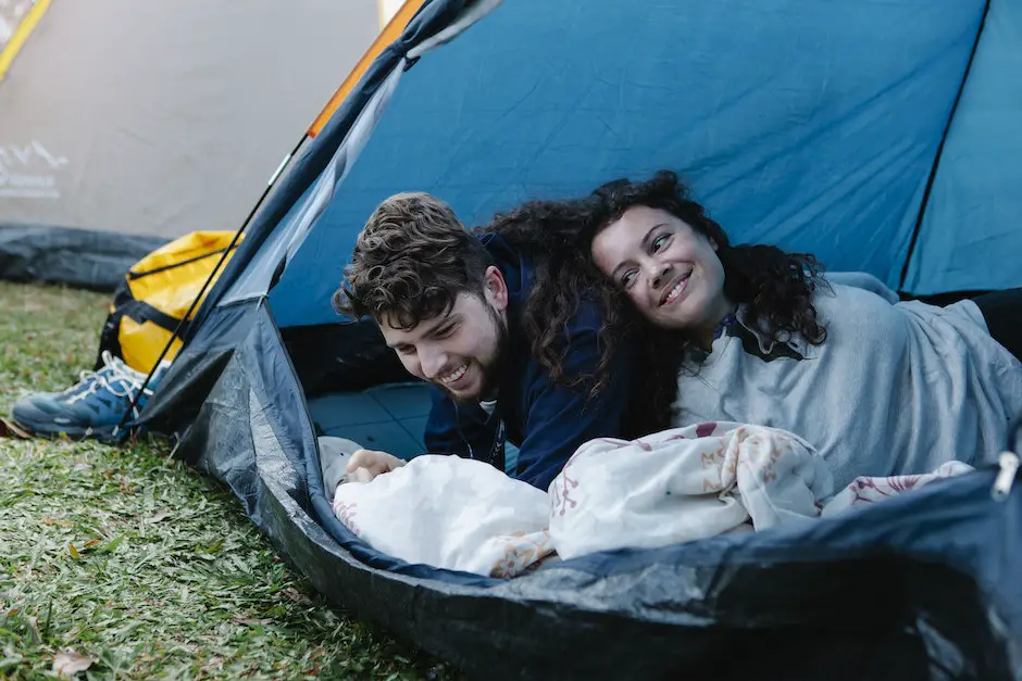 Happy couple relaxing in camping tent